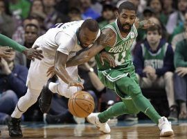 Kemba Walker and Kyrie Irving battle in a Hornets/Celtics game. (Image: Chuck Burton/AP)