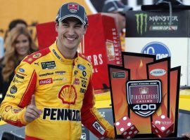 Joey Logano jumped out to the lead on a late restart to win on Monday at Michigan International Speedway. (Image: Carlos Osorio/AP)