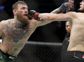 Khabib Nurmagomedov (right) says he has little interest in a rematch with Conor McGregor (left). (Image: John Locher/AP)