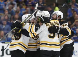 Patrice Bergeron (37) of the Boston Bruins celebrates with his teammates after scoring a goal against the St. Louis Blues in Game 3 of the Stanley Cup Finals. (Image: Jeff Roberson/AP)