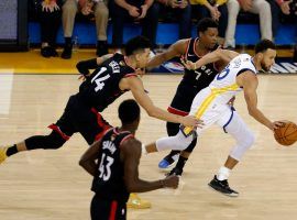 Steph Curry of the Golden State Warriors splits through multiple defenders on the Toronto Raptors during Game 3 of the NBA Finals at Oracle Arena in Oakland. (Image: Lachlan Cunningham/Getty)