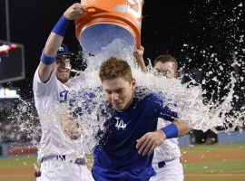 Will Smith, rookie catcher for the LA Dodgers, gets soaked by his teammates celebrating a walk-off home run against the Phillies at Dodger Stadium in Los Angeles. (Image: AP)