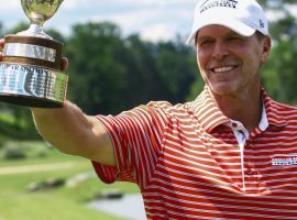 Steve Stricker holds up the trophy after winning the Regions Tradition Champions Tour golf tournament, Monday, May 13, 2019, in Birmingham, Ala. (AP Photo/Butch Dill)