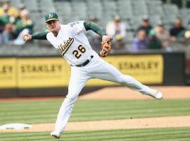 Oakland Aâ€™s third baseman throwing out a runner on the Seattle Mariners in Oakland, CA. (Image: Ezra Shaw/Getty)