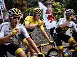 Champion Geraint Thomas celebrates with teammates while riding the final stage in the streets of Paris during the 2018 Tour de France. (Image: AFP/Getty)