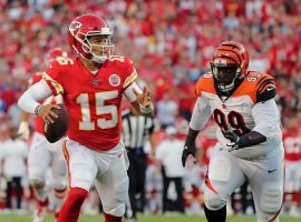 KC Chiefs QB Patrick Mahomes evades a defender during a preseason game against the Bengals. (Image: Jay Biggerstaff/USA Today Sports)