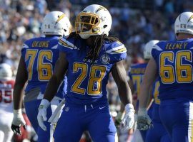 Running back Melvin Gordon of the LA Chargers celebrating a score against the Arizona Cardinals. (Image: Jake Roth/USA Today Sports)