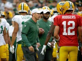 New head coach Matt LeFluer chats with QB Aaron Rodgers at the Green Bay Packers training camp. (Image: Matt Roemer/AP)