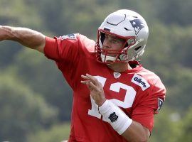 Tom Brady, QB of the New England Patriots, throws a pass in training camp. (Image: AP)