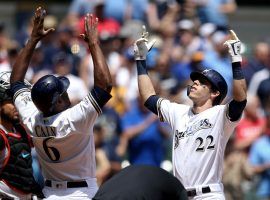 Lorenzo Cain of the Milwaukee Brewers congratulates Christian Yelich after a home run at Miller Park. (Image: Dylan Buell/Getty)