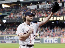 Houston Astros pitcher Gerrit Cole acknowledges the crowd after recording his 300 th strikeout of the season. (Image: Michael Wyke/AP)