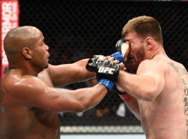 Stipe Miocic (right) will likely be unable to fight again in 2019 after an eye injury sustained against Daniel Cormier (left) in August due to an accidental poke similar to this one, from their first fight. (Image: Josh Hedges/Zuffa)