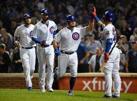 Kyle Schwarber is congratulated by hisÂ  teammates after slugging a 3-run home run against the St. Louis Cardinals at Wrigley Field. (Image: Quinn Harris/Getty)