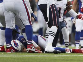 Buffalo Bills QB Josh Allen on the ground after a helmet-to-helmet hit from the New England Patriots. (Image: Ron Schwane/AP)