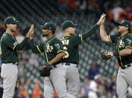 The Oakland A's celebrate a big win over the Astros in Houston. (Image: Tim Warner/Getty)