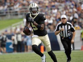 New Orleans Saints backup QB Teddy Bridgewater scrambles after replacing an injured Drew Brees. (Image: Marcio Jose Sanchez/AP)