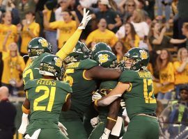 The Baylor Bears celebrate a touchdown in double overtime against Texas Tech in Waco, TX. (Image: Jerry Larson/AP)