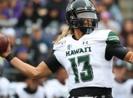 Hawaii quarterback Cole McDonald drops back to pass against Washington at Husky Stadium in Seattle, WA. (Image: Abbie Parr/Getty)