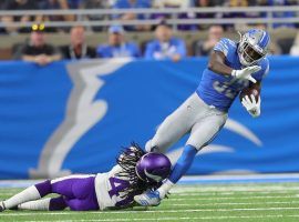 Detroit Lions RB Kerryon Johnson tries to evade a tackler from the Minnesota Vikings in Week 7. (Image: Kirthmon F. Dozier/Detroit Free Press)