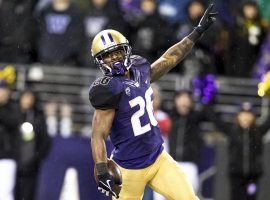 Washington RB Salvon Ahmed celebrates after scoring a touchdown at Husky Stadium in Seattle. (Image: Bettina Hansen/Seattle Times)