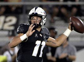 UCF Freshman QB Dillon Gabriel passes in a victory against UCONN in Orlando, FL. (Image: Phelan M. Ebenhack/AP)