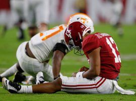 Alabama quarterback Tua Tagovailoa suffered a high-ankle sprain against Tennessee, and coach Nick Saban is unsure of his return. (Image: Getty)