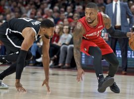 Damian Lillard blows by Brooklyn Nets guard Garret Temple during his 60-point career night in Portland. (Image: Craig Mitchelldyer/AP)