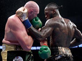 Tyson Fury (left) is a slight favorite over Deontay Wilder (right) in their rematch, which has been confirmed for Feb. 22. (Image: Harry How/Getty)