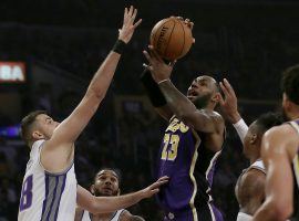 Lakers forward LeBron James drives to the hole against the Sacramento Kings at Staples Center in LA. (Image: Alex Gallardo/AP)