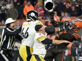 Myles Garrett (right) has been indefinitely suspended after ripping off Mason Rudolphâ€™s helmet and then hitting him in the head with it. (Image: Getty)