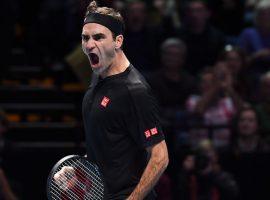 Roger Federer beat Novak Djokovic in straight sets to reach the semifinals at the ATP Finals in London. (Image: Alberto Pezzali/AP)