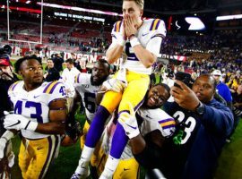 Quarterback Joe Burrow is carried off the field by teammates after LSU defeated Alabama and moved to No. 1 in the College Football Playoff Rankings. (Image: The State)