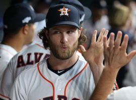 Ex-Houston Astros pitcher Gerrit Cole gets a high-five from teammates in Houston during the 2019 ALCS. (Image: Porter Lambert/Getty)