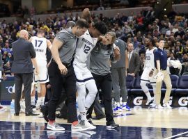 Memphis Grizzlies rookie point guard Ja Morant is helped off the court after a nasty fall against the Indiana Pacers. (Image: Andy Lyons/Getty)