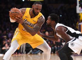 LA Clippers guard, Patrick Beverly (right), defends LA Lakers star LeBron James at Staples Center in LA. (Image: Getty)