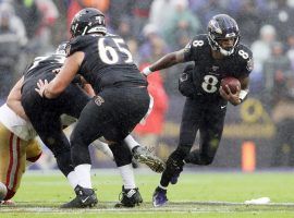 Baltimore Ravens RB Lamar Jackson evades the San Francisco pass rush during Week 13. (Image: Patrick Smith/Getty)