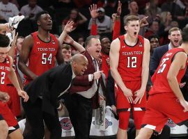 The Texas Tech bench celebrates during their 70-57 upset victory over #1 Louisville at MSG in New York City. (Image: Kathy Willens/AP)