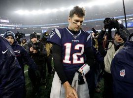 A dejected New England quarterback Tom Brady leaves the field after losing to Tennessee in the Patriots Wild Card Playoff game. (Image: Getty)