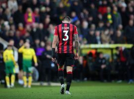 NORWICH, ENGLAND - JANUARY 18: Steve Cook of AFC Bournemouth walks off the pitch after being sent off for handball during the Premier League match between Norwich City and AFC Bournemouth  at Carrow Road on January 18, 2020 in Norwich, United Kingdom. (Photo by Marc Atkins/Getty Images)