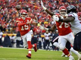 Patrick Mahomes of the Kansas City Chiefs tosses a touchdown pass against the Houston Texans during an AFC Divisional round playoff game. (Image: Ed Zurga/AP)