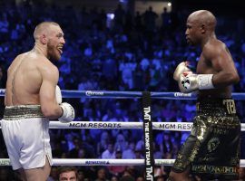 Conor McGregor (left) believes there’s a chance he could fight a rematch in the boxing ring with Floyd Mayweather Jr. (right). (Image: AP)