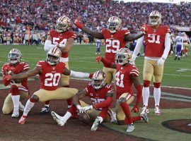 The San Francisco 49ers defense celebrates an interception by Richard Sherman (25) against the Minnesota Vikings at Levi Stadium in Santa Clara, CA. (Image: Marcio Jose Sanchez/AP)