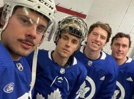 Justin Bieber, second from left, poses with members of the Toronto Maple Leafs after playing in a pick up hockey game with them over the Christmas holidays. (Image: Instagram)