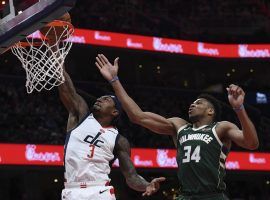 Washington Wizards guard Bradley Beal drives to the basket with Giannis Antetokounmpo of the Milwaukee Bucks in hot pursuit at Capital One Arena in Washington, DC. (Image: Marco Esquondoles/Getty)