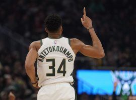 Milwaukee Bucks star, Giannis Antetokounmpo, celebrates a three-pointer against the Cleveland Cavs in Milwaukee, WI. (Image: Morry Gash/AP)