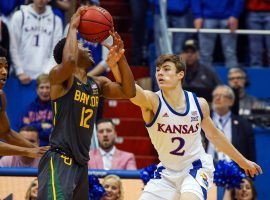 Baylor guard Jared Butler (12) defended by Kansas guard Christian Braun in Lawrence, Kansas. (Image: Jay Biggerstaff/USA Today Sports)