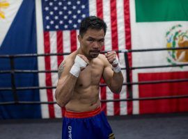 Manny Pacquiao signed with the same promotional company that represents Conor McGregor, moving the two men closer to a crossover fight. (Image: Apu Gomes/Getty)