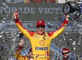 Joey Logano held off Kevin Harvick in an overtime shootout to win at Phoenix Raceway on Sunday. (Image: AP)