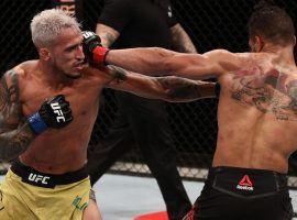Charles Oliveira (left) submitted Kevin Lee (right) in the main event of UFC Fight Night 170 on Saturday. (Image: Buda Mendes/UFC/Getty)