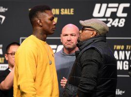 Israel Adesanya (left) will defend his UFC middleweight title against Yoel Romero (right) at UF 248 on Saturday. (Image: Josh Hedges/Getty)